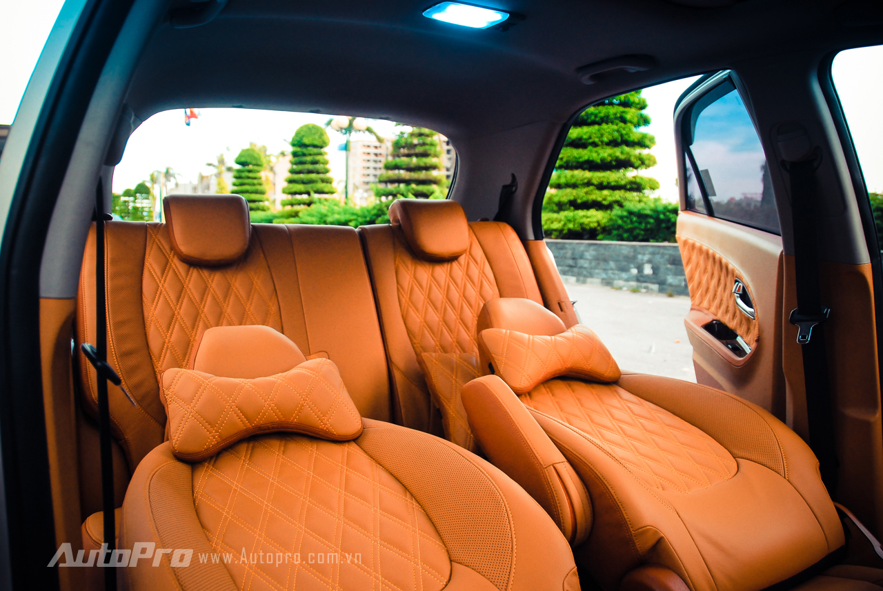 The entire two rows of seats inside the Kia Morning car are reupholstered in a new bright brown leather according to the owner's preferences.