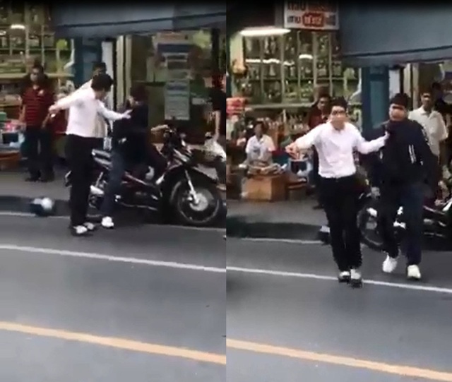
Người đàn ông mặc áo sơ-mi lôi xềnh xệch người đi xe máy trên phố. Ảnh cắt từ video
