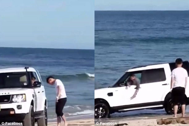 Đỗ trên bờ biển, SUV hạng sang Land Rover suýt bị sóng nhấn chìm - Ảnh 1.