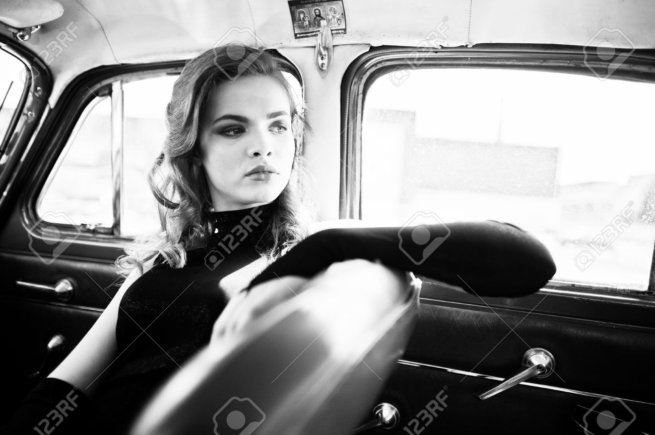 Glamorous girl beside vintage car - Image 1.