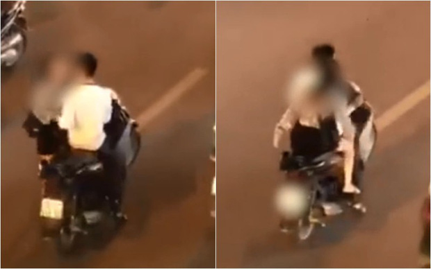 Clip: Đôi nam nữ gây bức xúc khi không đội mũ bảo hiểm, dừng xe máy giữa đường phố để... cãi nhau - Ảnh 2.