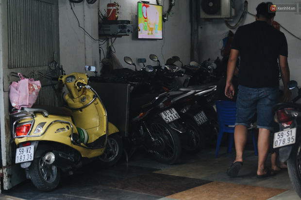 Dịch vụ giữ xe máy xuyên Tết cho người dân rời Sài Gòn về quê hốt tiền triệu mỗi ngày - Ảnh 6.