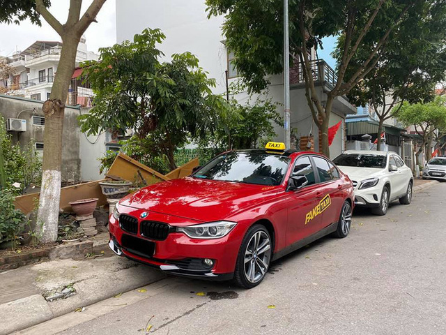BMW tiền tỉ gắn biển taxi chạy trên phố Hà Nội khiến người đi đường xôn xao, chụp ảnh đăng lên MXH - Ảnh 4.