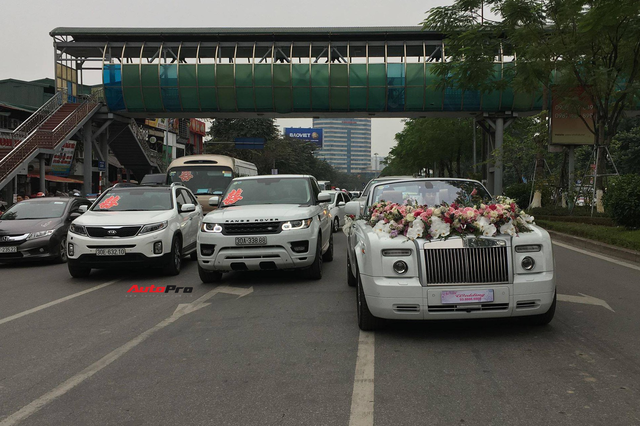 Đám cưới đại gia Hà thành quy tụ Rolls-Royce Phantom Drophead Coupe và cặp Range Rover đúng ngày Việt Nam vô địch - Ảnh 3.