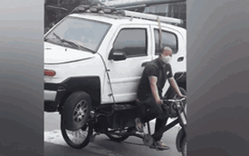 Clip: Người đàn ông dùng xe 3 bánh chở ô tô bon bon trên phố