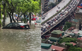 Toàn cảnh một buổi sáng "không tưởng" ở Hà Nội: Nước ngập đến thắt lưng, người dân vật lộn di chuyển giữa phố phường