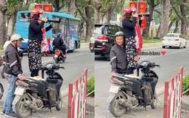 Clip cụ ông dựng xe máy giúp vợ chụp ảnh 'với cả bầu trời cưng chiều' gây sốt