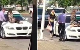 Vợ ngồi trên nắp capô xe BMW để ngăn chồng đi với nhân tình