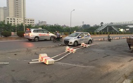 Hà Nội: Taxi "hạ gục" một đoạn dải phân cách dài trong đêm
