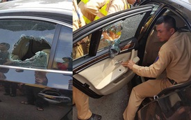 Hà Nội: CSGT dùng búa đập kính xe BMW, cứu người bị ngất bên trong