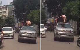 Người phụ nữ đùng đùng trèo lên nóc xe ô tô nhảy nhót, múa may nhưng hành động của tài xế lại gây tranh cãi dữ dội