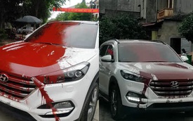 Hình ảnh ô tô trắng bị vấy sơn đỏ khắp thân xe khiến các diễn đàn mạng “sôi sục" trong ngày cuối tuần